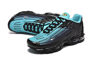 Pair of black and bright blue Nike Air Max Plus III sneakers shown at an angled view.