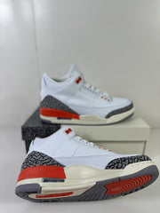 Angled underside view showing the patterned outsole, red traction area, and elephant-print overlays.
