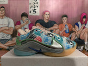 Side view showing the printed upper, blue Nike Swoosh, metallic-look panel, and green trim.