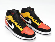 Three-quarter view showing the black, yellow, red, and white color-blocked high-top sneaker design