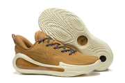 Three-quarter view of brown sneakers showing the textured upper, patterned outsole, and heel cushioning elements.