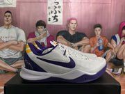 Side view showing the white upper, purple Nike Swoosh, purple heel details, and yellow accents.