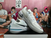 Angled view showing the white knit-like exterior, black Swoosh, and pale blue heel detail.