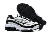 Nike Shox R4 sneakers shown from the side and outsole, highlighting the black tread.