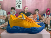 Side profile of a yellow and blue basketball sneaker