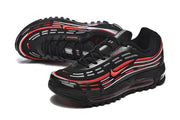 Angled view of black lace-up sneakers with red and silver wavy side detailing.