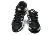 Front view of black and white Nike basketball-style sneakers with lace-up fronts and contrasting side details.