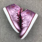 Top-down view of the pair with spare laces placed between the shoes.