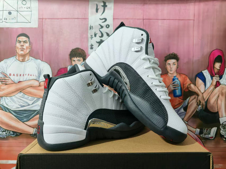 Pair of white and navy Jordan high-top basketball sneakers shown from the side and outsole angles on a shoe box.