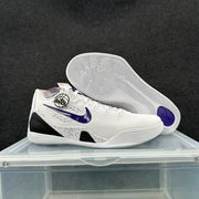 White low-top basketball shoe shown beside its wavy-patterned outsole