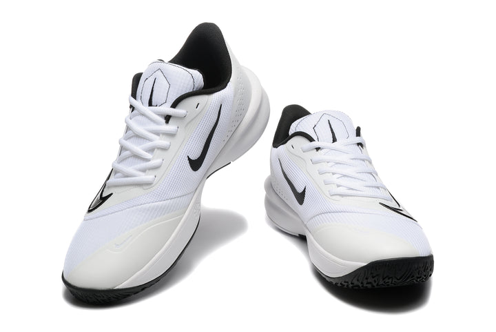 Pair of white and black Nike Precision 7 basketball shoes shown from above