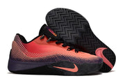 Side and outsole views of a coral Nike S.T. Flare EP shoe with dark purple accents.