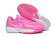 Side view of a pink Nike sneaker with a white Swoosh, white midsole, and textured outsole.