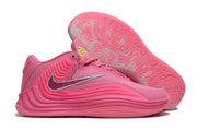 Pink Nike Giannis Immortality 7 shoe with patterned outsole view