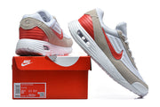 Nike Air Max Verse white and red sneakers shown with a red shoe box; the box label displays a sample size.
