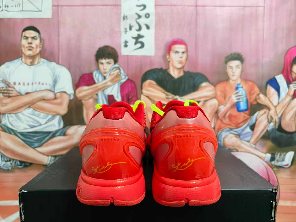 Rear view of red Nike basketball sneakers showing translucent heel panels and yellow heel markings.
