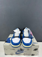Pair of sneakers shown from the front, highlighting the perforated white toe panels and blue overlays.