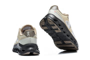 Rear and outsole views of the On Cloudtilt Remix sneakers.