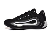 Side profile of a black sneaker with white and gray layered detailing and visible Cushion marking.