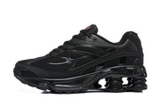 Side view of black Nike Shox Ride 2 sneakers showing mesh panels, layered side detailing, and a sculpted sole.
