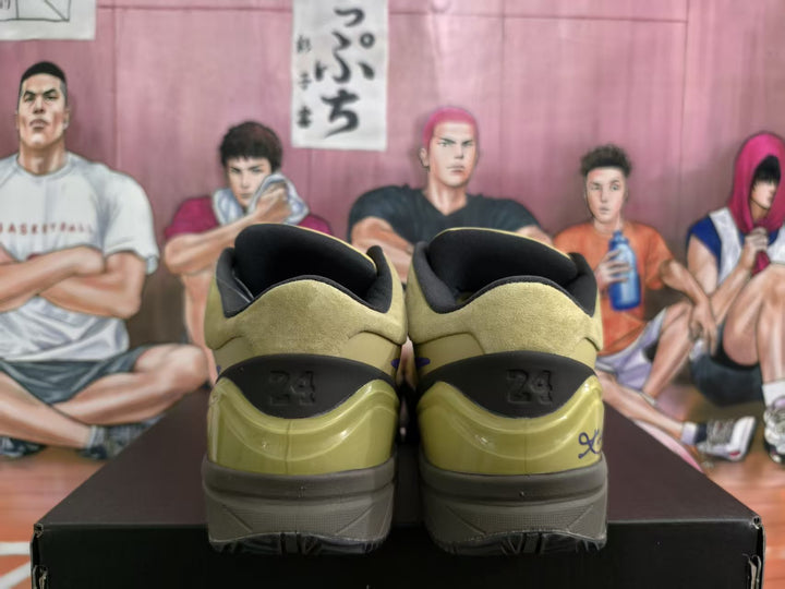Rear view of olive and black basketball sneakers showing size 34 markings on the photographed pair.