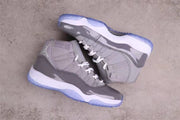 Overhead angled view of the pair highlighting the high-top construction, grey panels, white midsoles, and blue outsoles.