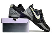 Black Nike Ja 2 shoes shown from rear and side beside a shoe box