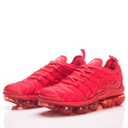 Pair of red Nike sneakers viewed from the front and side.