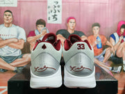 Rear view showing the padded collars, number 33 heel details, and signature-style graphics.