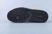 Full view of the black rubber outsole with circular and grid traction patterns.