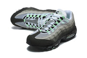 Angled top view of Nike Air Max 95 TT sneakers showing mesh panels, white laces and mint-green details.