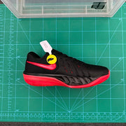 Opposite side view of a black Nike Kyrie 7 basketball shoe with red accents.