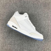 Angled side view showing the white Jordan 3 upper, perforated panels, and translucent blue outsole.