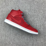 Single red high-top sneaker shown from the lateral side with gray laces, white midsole, and gray outsole.