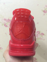 Rear close-up of a red high-top sneaker showing the heel logo detail.