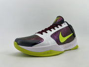 Angled front-side view of the white and purple Kobe basketball shoe.
