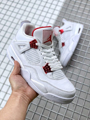 Close angled view of the sneaker's laces, red eyelets, mesh panel, and tongue branding.