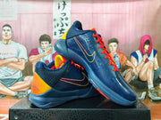 Angled view of navy basketball shoes with perforated panels and yellow Swoosh detailing
