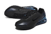 Pair of black Nike sneakers with blue heel details, shown at an angle.