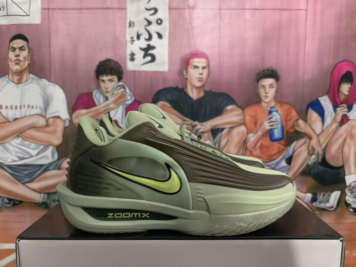 Side view of olive green Nike sneakers showing the lime Swoosh, layered upper and ZoomX midsole marking.