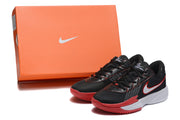 Black and red Nike basketball shoes displayed beside an orange Nike shoe box.
