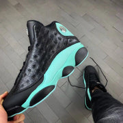 Angled side view showing the black outsole pods and green midsole