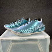 Pair of glossy aqua-blue low-top basketball shoes shown from the side