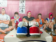 Heel view of Nike basketball shoes showing contrasting blue and red heel panels.