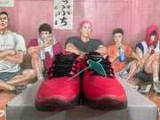 Red and black Nike basketball shoes shown from the front