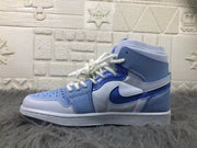 Side view highlighting the high-top collar, layered blue and white panels, Swoosh, and rubber outsole.