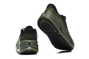 Heel and outsole views of olive and black Nike running shoes.