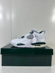 Opposite side view showing the white upper, green accents, mesh panels, and attached circular hangtag.