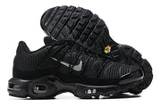 Black sneaker side view and outsole showing textured tread and visible sole cushioning windows