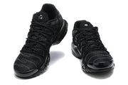 Front view of black Nike Air Max Plus sneakers